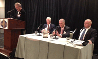 NAFB President-elect Mark Oppold at podium, and seated (l to r) are Bob Bergland, (Carter administration); John Block, (Reagan administration); and Clayton Yeutter, (Bush administration)